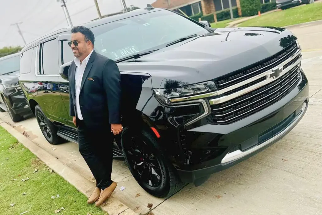 happy chauffeur with Chevrolet suburban