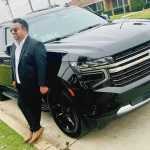 happy chauffeur with Chevrolet suburban