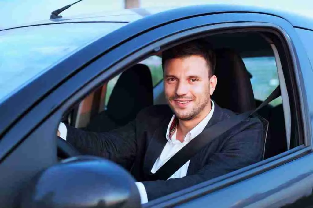 Professional Chauffeur in black car